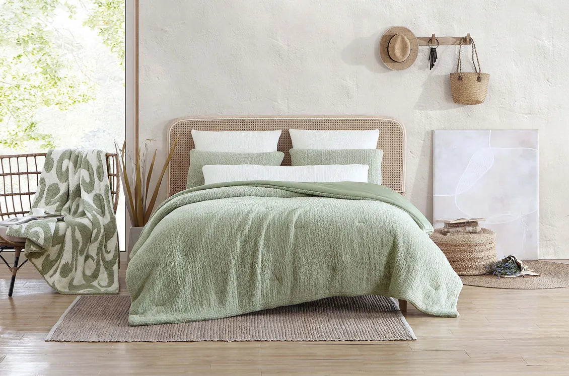 Snug Stitch Comforter folded neatly in soft neutral tones