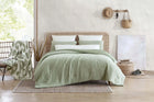 Snug Stitch Comforter folded neatly in soft neutral tones