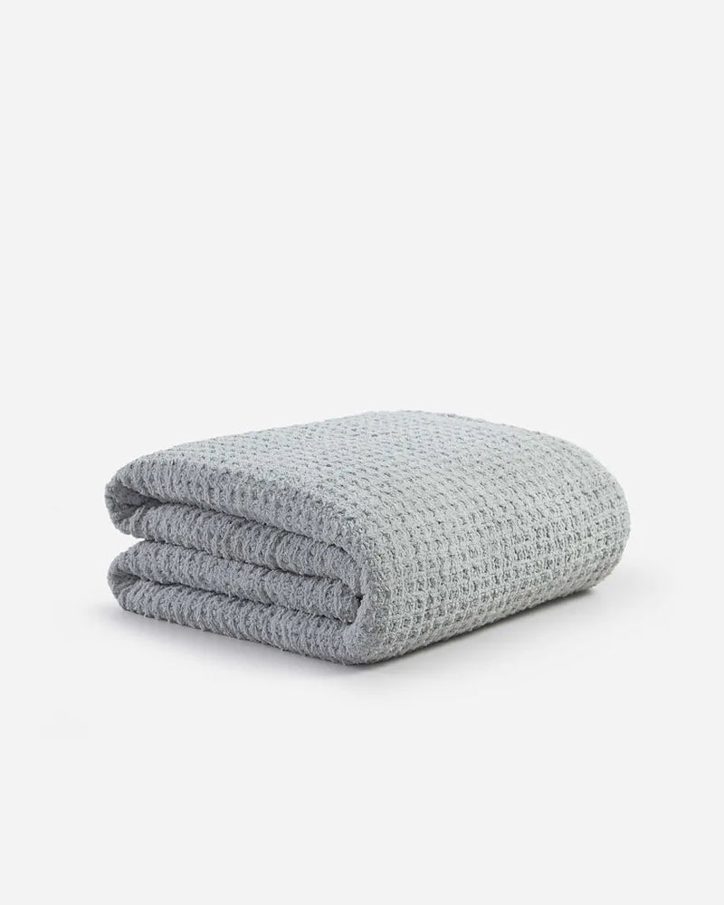 Eco-friendly waffle comforter styled on modern bed
