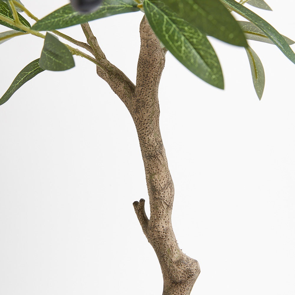Mediterranean-style artificial olive tree styled in living room