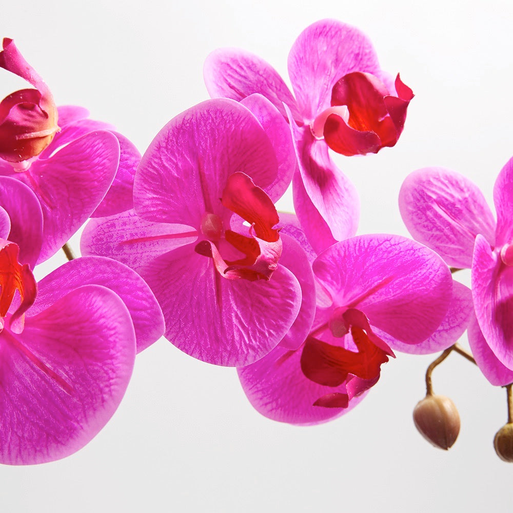 Pink Artificial orchid arrangement in modern grey vase