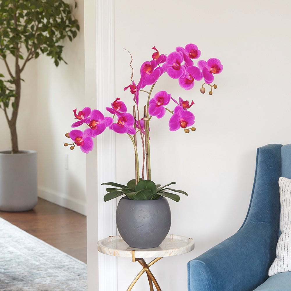 Lifelike Artificial orchid plant with soft pink blooms