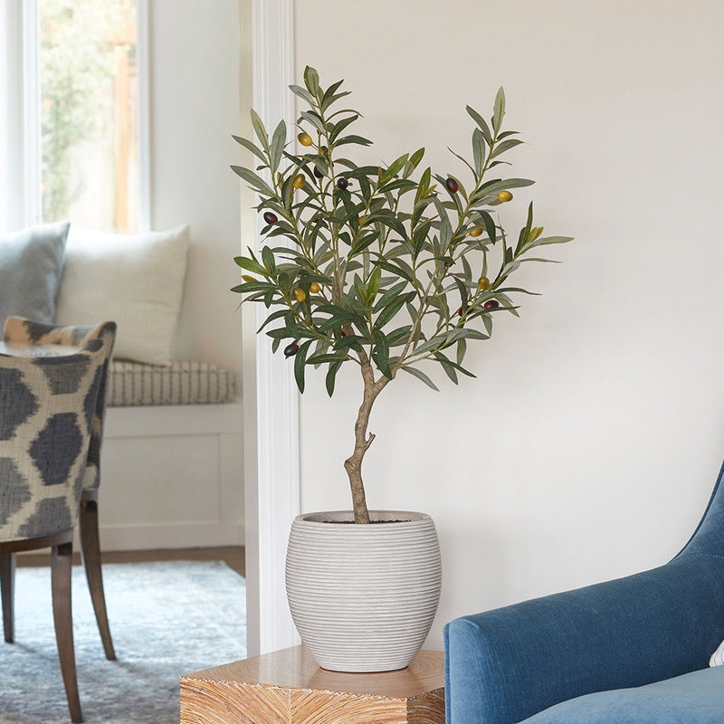 Faux olive tree with silvery-green leaves and realistic olives