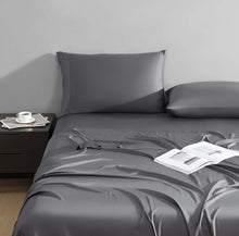 Eco-friendly bamboo pillowcases stacked on nightstand