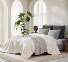 Luxurious Cloud Silque Stitch Comforter folded neatly at end of bed