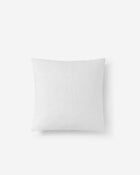 Cloud Silque Throw Pillow on bed with layered textiles