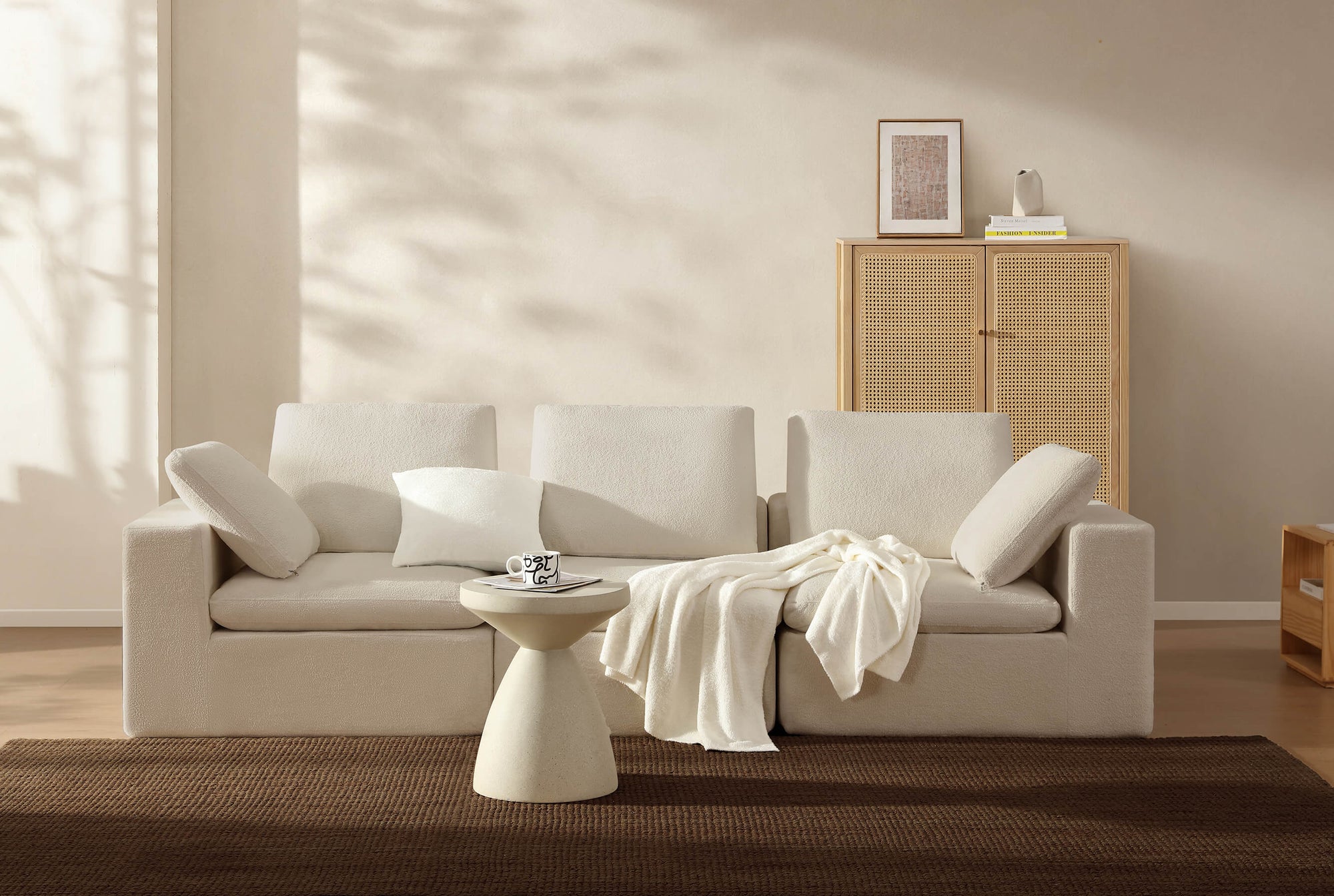 Oversized Cloud Silque Throw folded neatly at the end of a bed