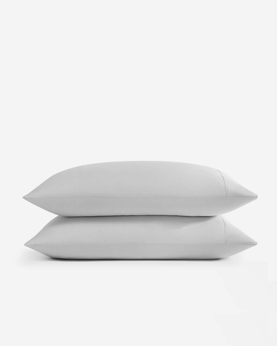 Silky fitted sheet and pillowcases styled on bed