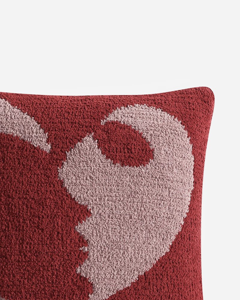 Artistic throw pillow with bold face design