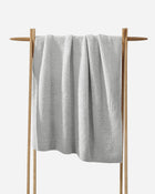 Compact personal-sized Snug Throw for travel or couch