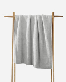 Compact personal-sized Snug Throw for travel or couch