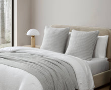 Sunday Citizen striped Euro pillow on sofa with layered textures