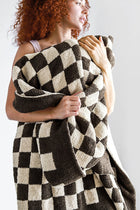 Soft double-knit checkerboard throw in neutral tones