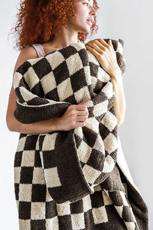 Soft double-knit checkerboard throw in neutral tones