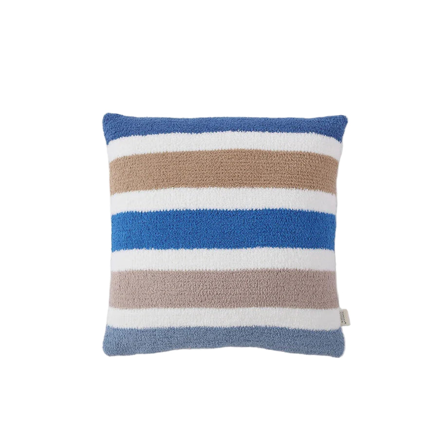Burano Throw Pillow styled on sofa with spring accents