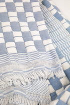 Quilted Sujani throw blanket in soft blue grey check