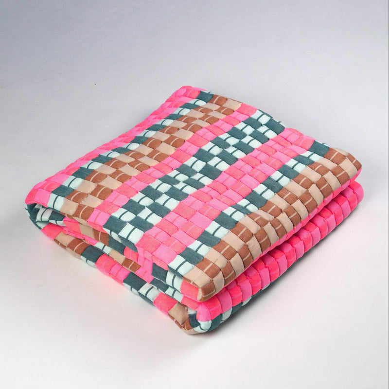 Quilted Sujani throw blanket in multi green and pink, folded