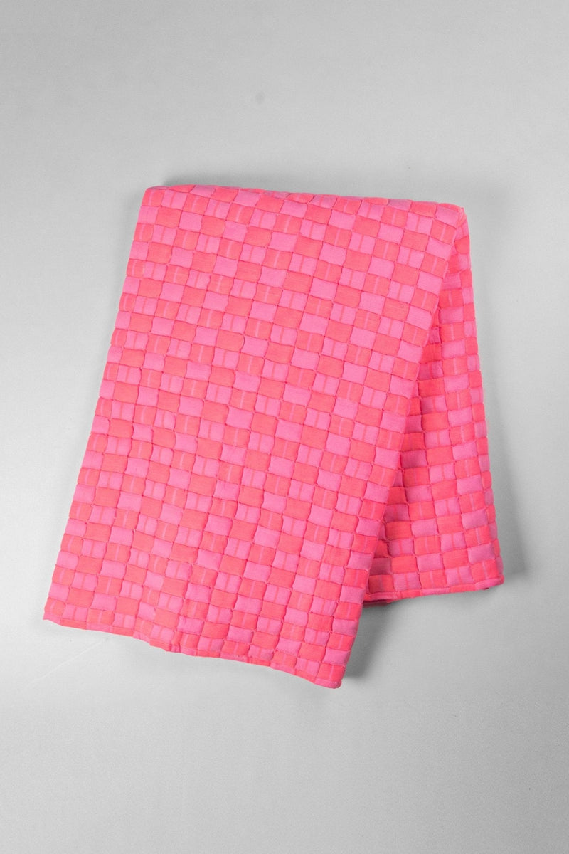 Quilted Sujani throw blanket in neon pink with stripe binding