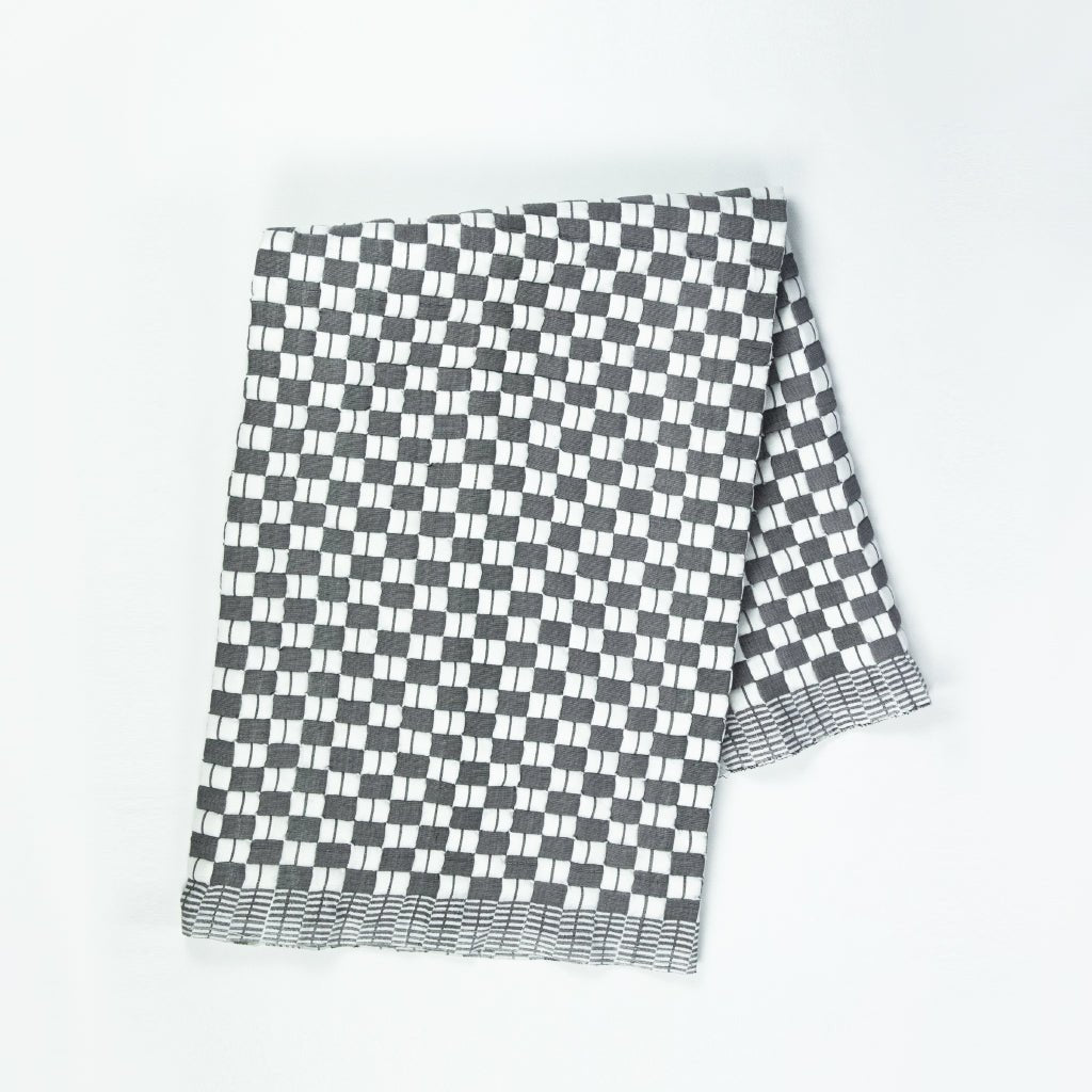 Quilted Sujani throw blanket in soft black and white, full view