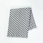 Quilted Sujani throw blanket in soft black and white, full view