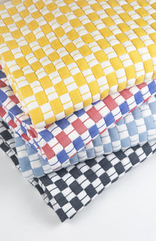 Quilted Sujani throw blanket in soft black and white, styled