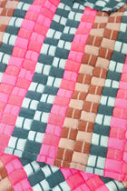 Close-up of the quilted Sujani throw blanket weave in multi green and pink