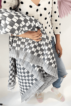 Quilted Sujani throw blanket in soft black and white