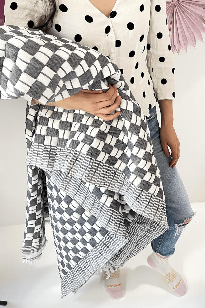 Quilted Sujani throw blanket in soft black and white