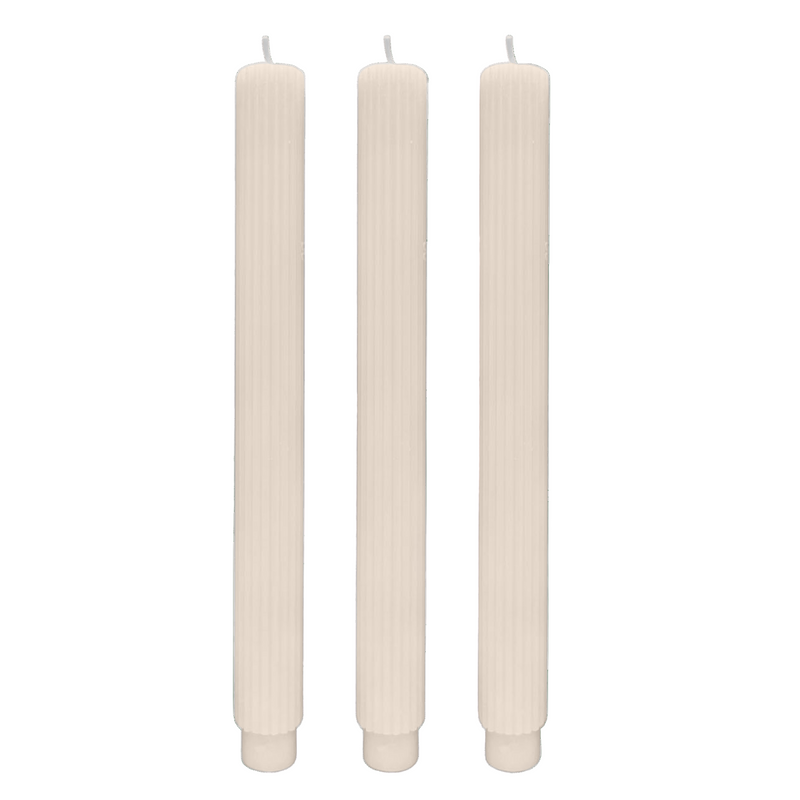 White fluted taper candles set of 3 on table
