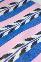 Close-up of the hand-dyed palm ikat pattern in blue and pink