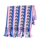 Palm ikat blanket in blue and pink, folded