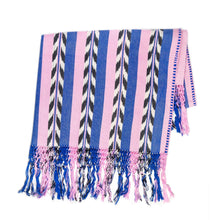 Palm ikat blanket in blue and pink, folded