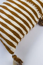 Close-up of the handwoven Antigua pillow in umber brown stripe