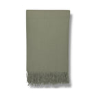 Soft sage green fringe throw blanket with herringbone texture