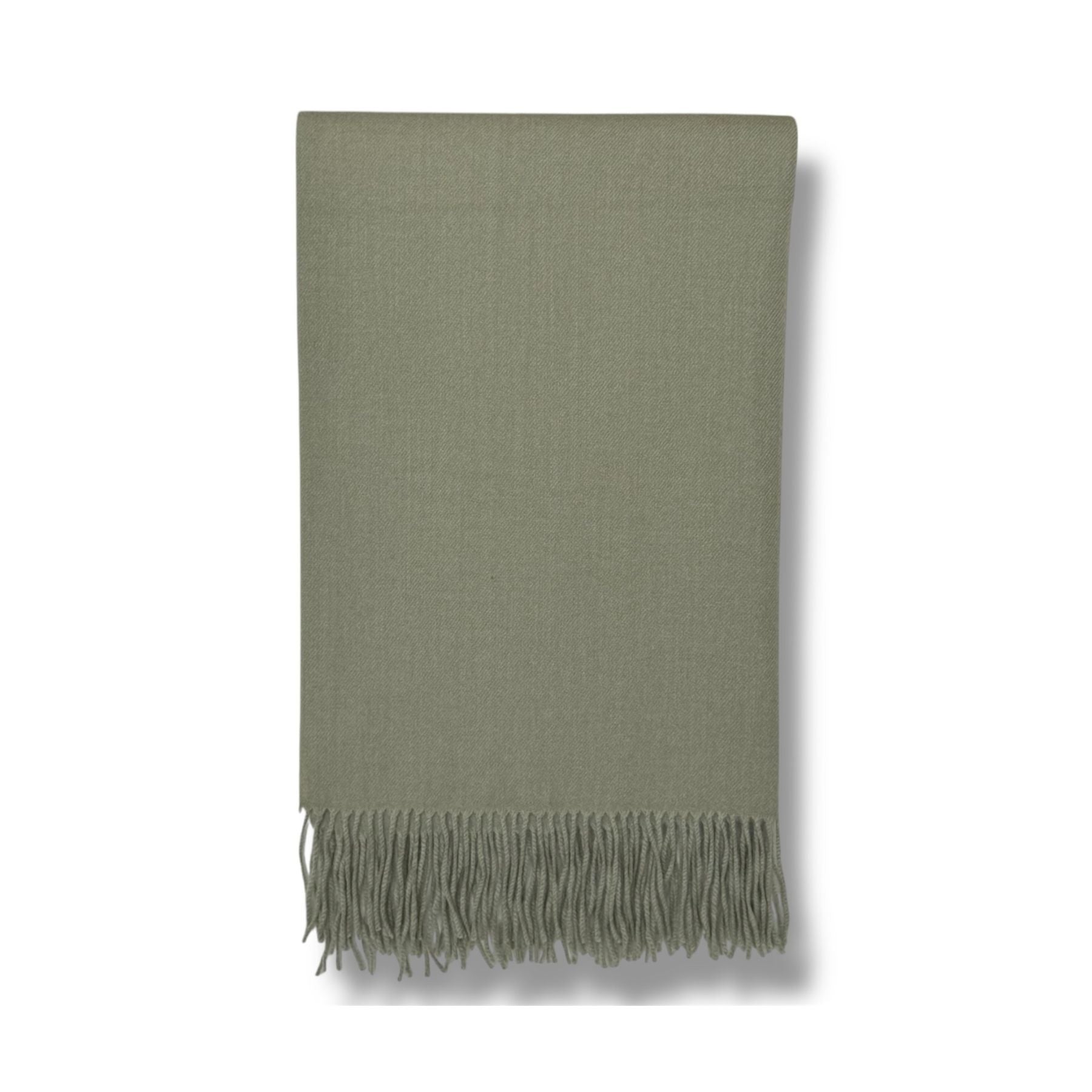 Soft sage green fringe throw blanket with herringbone texture