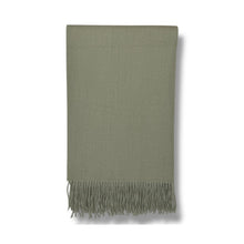 Soft sage green fringe throw blanket with herringbone texture