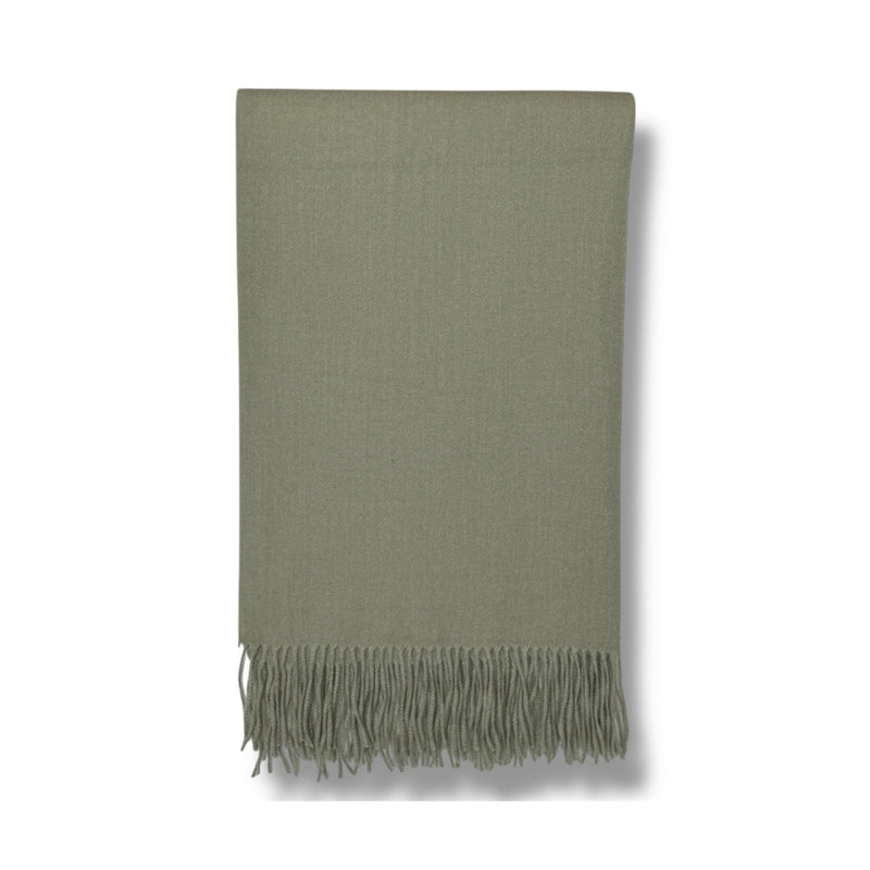 Soft sage green fringe throw blanket with herringbone texture