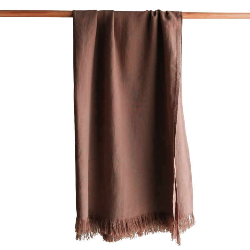 Handcrafted linen throw blanket with fringe detailing