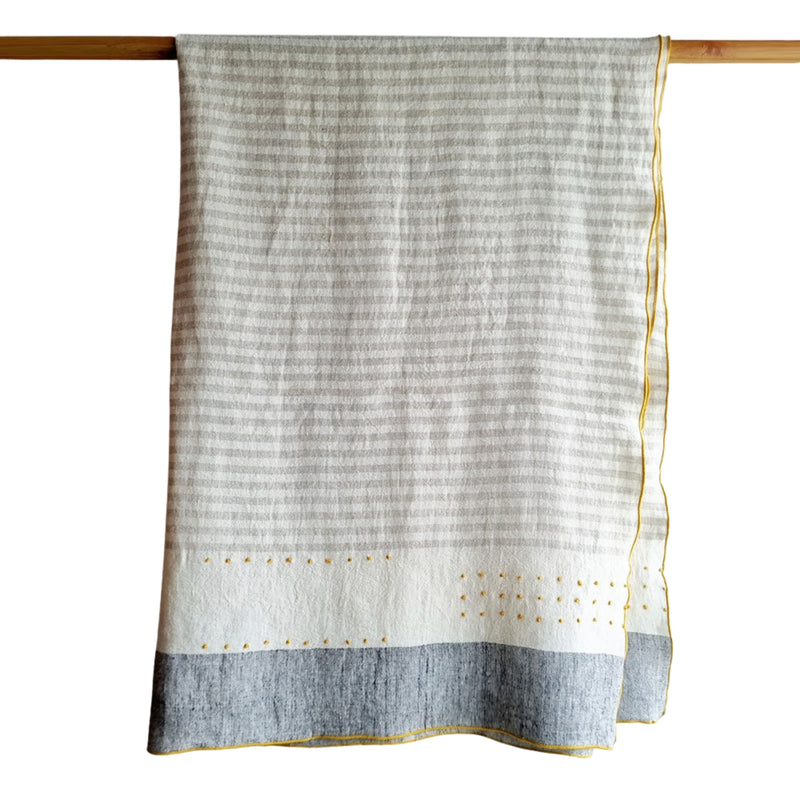 Handcrafted linen throw blanket with subtle stripe design