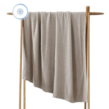 Oversized Cloud Cool Throw draped across a sofa