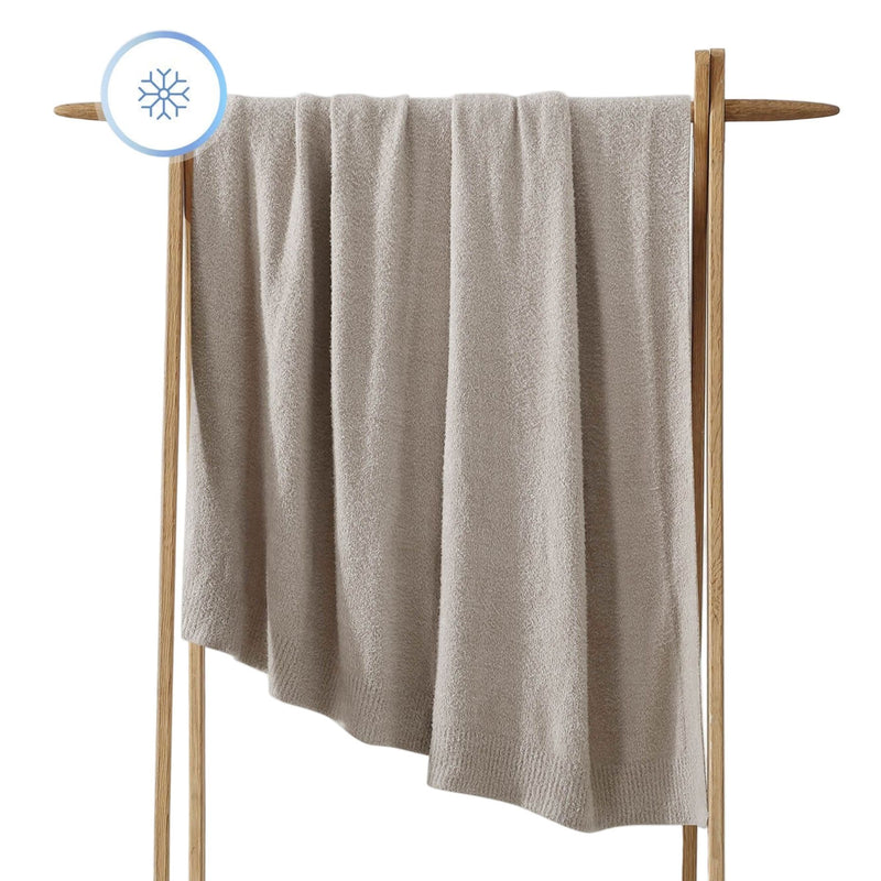 Oversized Cloud Cool Throw draped across a sofa