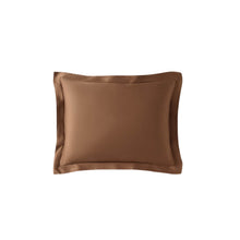 Natural bamboo sham set styled on bed in neutral tones