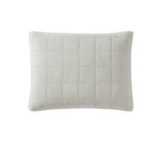 Stonewashed lyocell sham set in soft neutral tones on bed