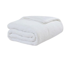 Snug Stitch Comforter styled on modern bed with stitched pattern