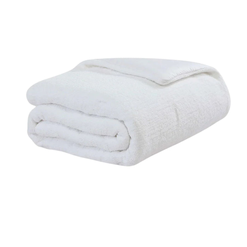 Snug Stitch Comforter styled on modern bed with stitched pattern