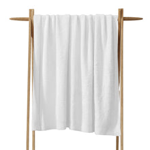 Cloud Silque Throw draped over a neutral-toned sofa