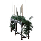 Lifelike faux cedar garland on staircase railing