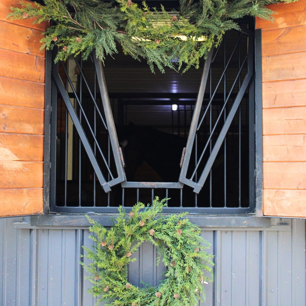 Elegant artificial Christmas wreath with lifelike pinecones