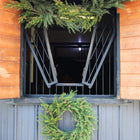 Elegant artificial Christmas wreath with lifelike pinecones