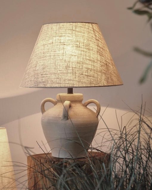 Ceramic vase-style table lamp with neutral fabric shade